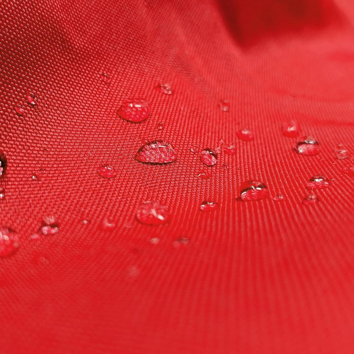 Water beading on red Weatherproof Shield fabric, close up