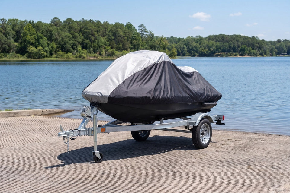 Sea-Doo Spark on its trailer under a gray and black Weatherproof Shield cover, at the top of a concrete boat ramp on a sunny lake