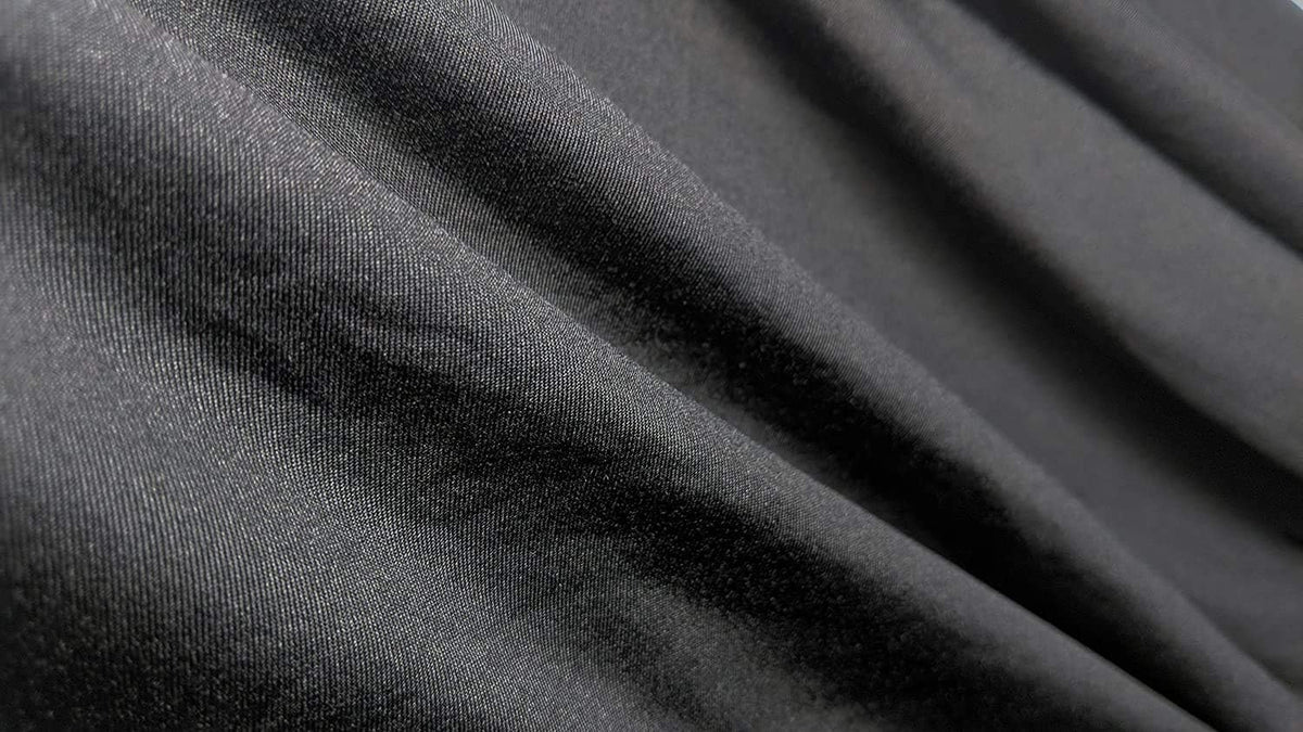 Close-up of black stretch fabric with a soft sheen